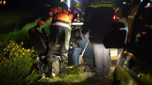 Scootmobiel te water bij Burgerbrug