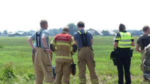 Fietsster met driewieler te water in Schagen